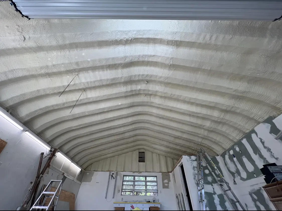 Spray polyurethane foam applied to the underside of a metal roof deck in Scranton